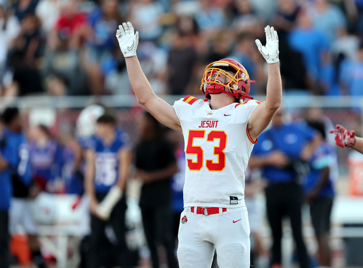 Jesuit linebacker Tristan Lebrecht praises the Holy Bowl Gods during his team's 41-8 win Saturday night. Photo: Dennis Lee